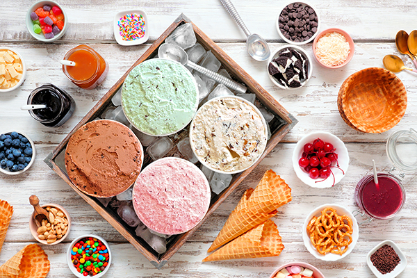 Aerial view of ice cream and toppings on a table