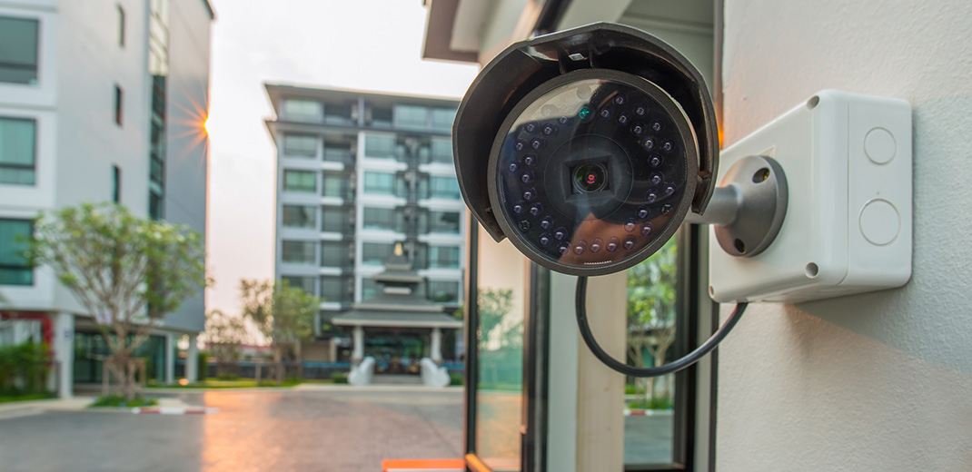 Security camera on side of building